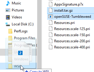 Screenshot showing openSUSE-Tumbleweed-20220224.zip with install.tar.gz and openSUSE-tumbleweed.exe being dragged from a ZIP archive to C:\WSL